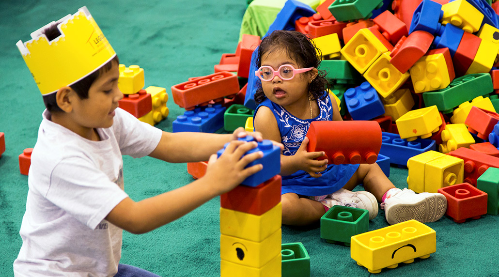 Two children play with building blocks at the Access Chicago Expo