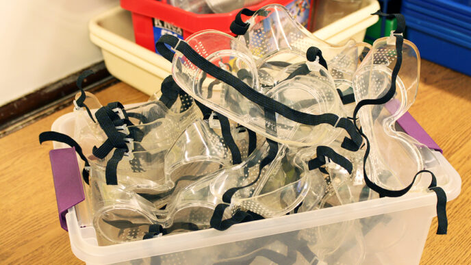 A bin of safety glasses||Science textbooks at Volta Elementary|Doorway to Chicago’s Volta Elementary School||The Science Olympiad team from Volta Elementary