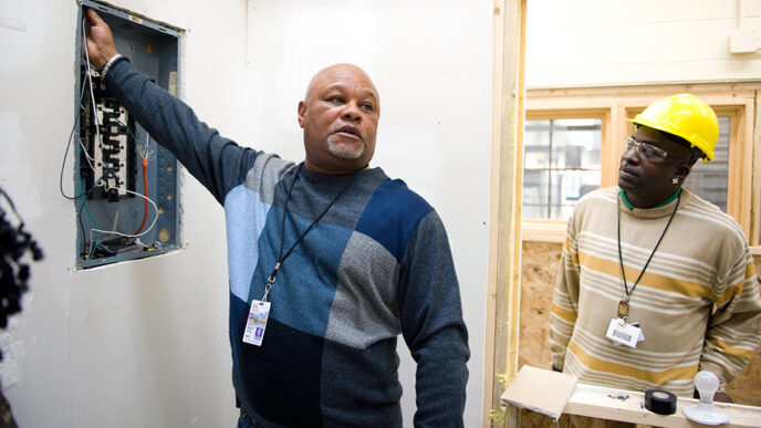 Electricians in training at construction site