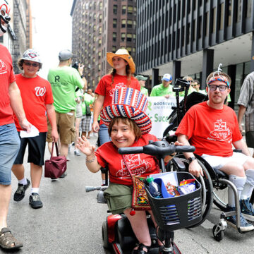 Members of Tellin' Tales Theatre at the Disability Pride Parade and Rally|Paula from Washington Heights at the Disability Pride Parade and Rally|Kevin at the Disability Pride Parade and Rally|Wanda and Kim at the Disability Pride Parade and Rally|Liz from Rogers Park at the Disability Pride Parade and Rally|Glenn and Sarah from Grayslake with their children at the Disability Pride Parade and Rally|Daniel from LaGrange at the Disability Pride Parade and Rally|Colleen from Western Springs with service dog Fiesta at the Disability Pride Parade and Rally|Rachel from Park Ridge and her friend Brandon at the Disability Pride Parade and Rally|Scott Nance of the Parade organizing committee.