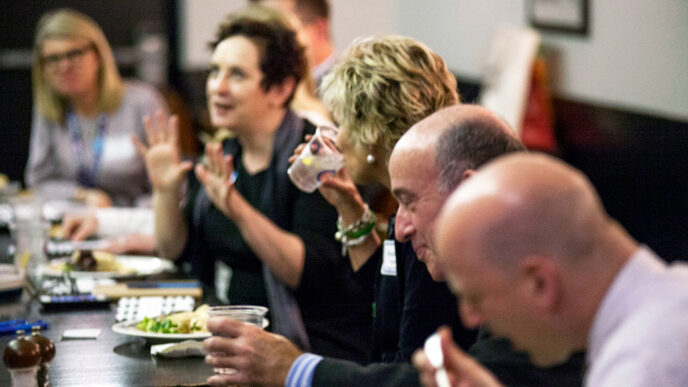 Guests enjoy conversation at an On the Table mealtime event