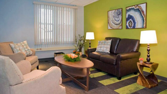 A comfortable interior space with green and blue walls