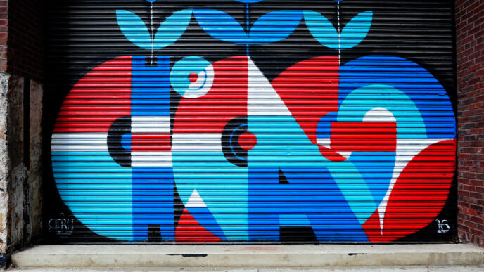 A mural on a metal loading dock door says Chicago in vibrant blue and red type.