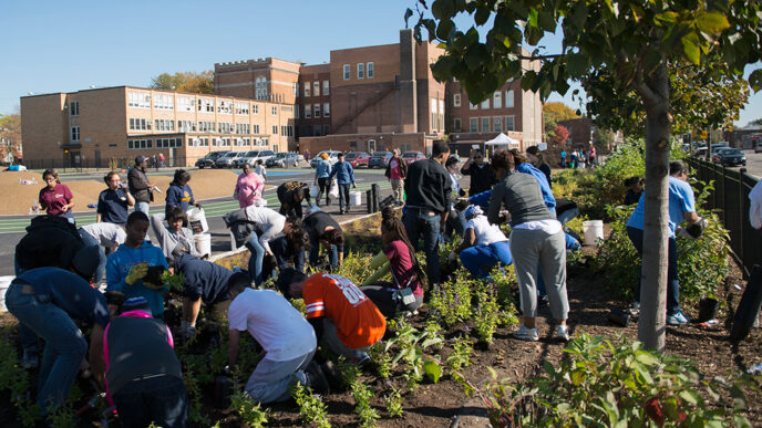 Community residents planting at a Space to Grow workday||Morril Elementary schoolyard after redevelopment|.
