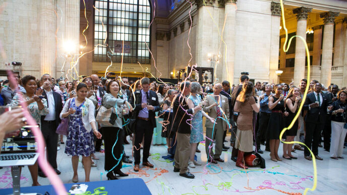 Guests at the Trust's Centennial Reunion|Drummers from Funkadesi performing|Wishes decorate the Wishing Tree art installation.