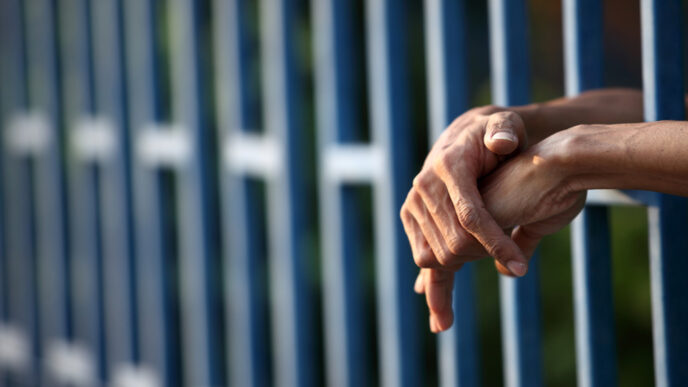 Close-up of prison inmate's hands