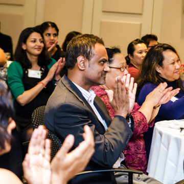 Guests applauding at the Asian Giving Circle reception|Guests in animated conversation|i2i’s Leakhena Yoeun talks with SAAPRI incoming executive director Reema Kapur.