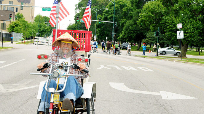 Cyclist on bike customized with American flags