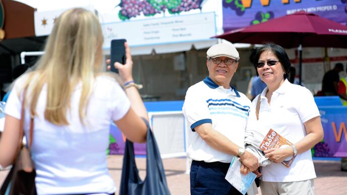 Capturing a moment at the Taste of Chicago|Taste of Chicago guests enjoy cooling off at Buckingham Fountain||||||||Erica at the Taste of Chicago|Ariel and Essia at the Taste of Chicago|Richard at the Taste of Chicago|.