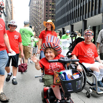Members of Tellin' Tales Theatre at the Disability Pride Parade and Rally|Paula from Washington Heights at the Disability Pride Parade and Rally|Kevin at the Disability Pride Parade and Rally|Wanda and Kim at the Disability Pride Parade and Rally|Liz from Rogers Park at the Disability Pride Parade and Rally|Glenn and Sarah from Grayslake with their children at the Disability Pride Parade and Rally|Daniel from LaGrange at the Disability Pride Parade and Rally|Colleen from Western Springs with service dog Fiesta at the Disability Pride Parade and Rally|Rachel from Park Ridge and her friend Brandon at the Disability Pride Parade and Rally|Scott Nance of the Parade organizing committee.