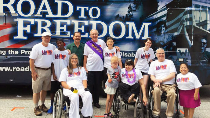 Trust CEO Terry Mazany with Parade Marshal Senator Tom Harkin at the 12th Annual Disability Pride Parade