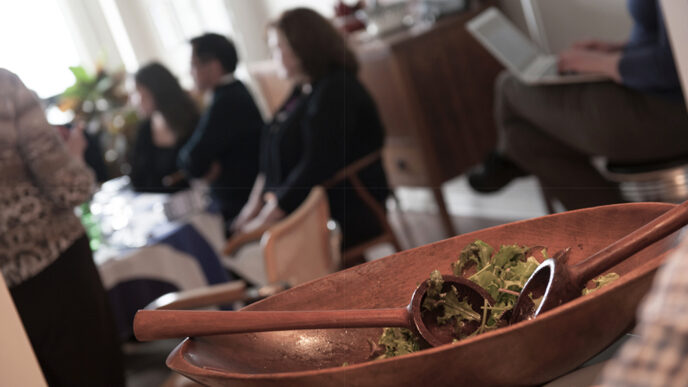 A salad bowl in the foreground.