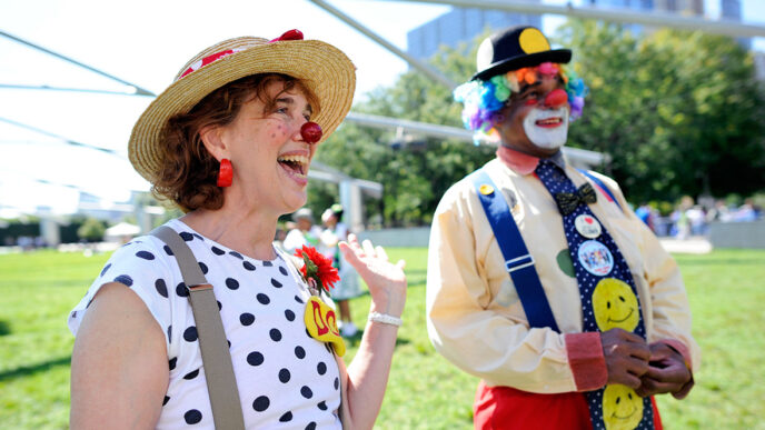 Karen Hoyer and another member of her clown troupe at Pritzker Pavilion in Millennium Park|.