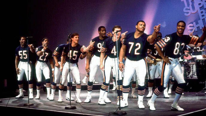The Chicago Bears' 1986 champion lineup on stage performing The Super Bowl Shuffle|.