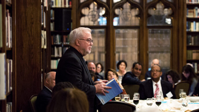 Rev. Jim Wallis addresses a group of Chicago civic leaders over dinner.