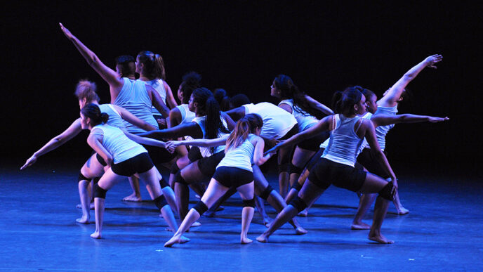 A teen dance troupe performs a contemporary-style routine on the Harris Theater stage at the Chicago Dancing Festival.