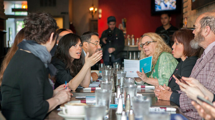 Guests talk over breakfast at an On the Table event.