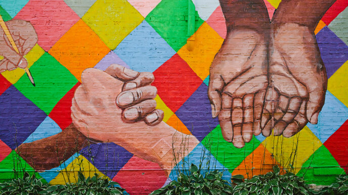 Mural depicting hands of many colors.