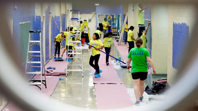 Students repaint a school hallway.