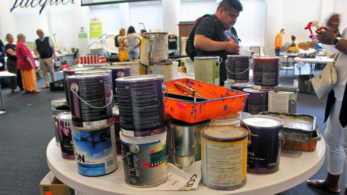 A table stacked with paint.