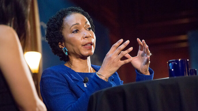 Dr. Helene Gayle seated on stage.