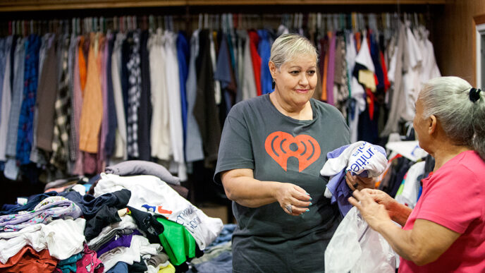 In a room filled with clothing.