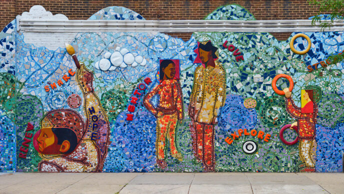 A colorful mural depicting people playing.